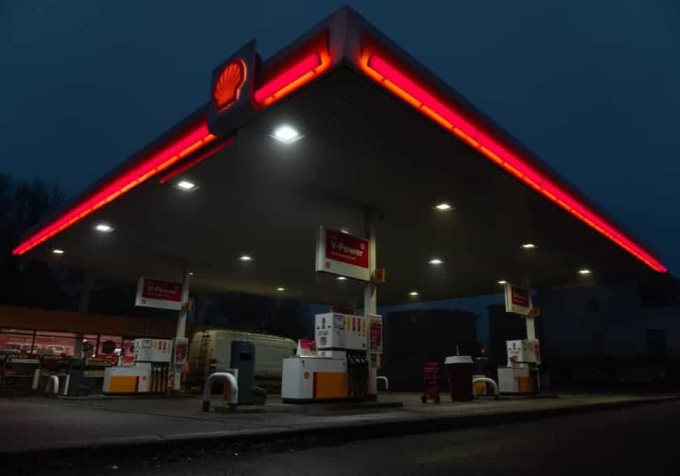 red and white store front during night time